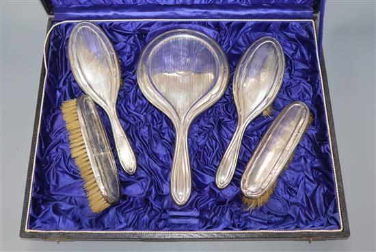 A cased silver dressing table set